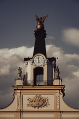A fragment of the historic entrance gate with a clock.