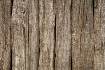 Vintage Timber cut planks forming a fence or a wall, distressed texture backdrop.