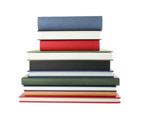 Many different books stacked on white background