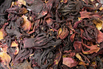 Texture of dry tea leaves. Detailed photo of dried tea leaves and flowers. Ready-to-eat food.