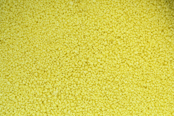 Yellow barley groats. Detailed texture of barley groats, macro photo. Uncooked washed raw barley porridge