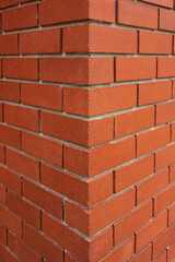 Red brick texture of the corner of the house.New Brick wall for background. House corner, Brick work