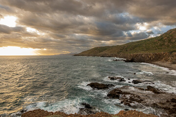 Morning on the coast of the Sea of Cortez: Baja de California Sur, Mexico with breaking waves and dramatic clouds.