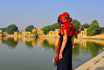 Fototapeta premium Asian woman visiting the Gadisar Lake in India