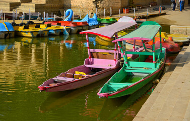 Fototapeta na wymiar Wooden boats dock on the tourist jetty
