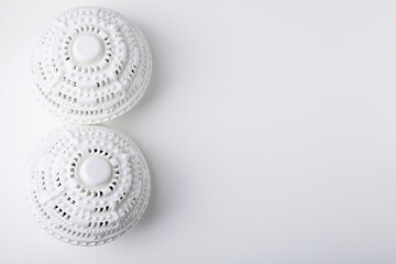 Laundry dryer balls on white table, flat lay. Space for text