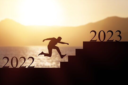 New year of 2023. Silhouette running on stairs.