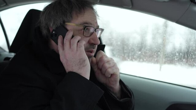 Freezing Car Driver Cold in His Car During Winter On the Phone