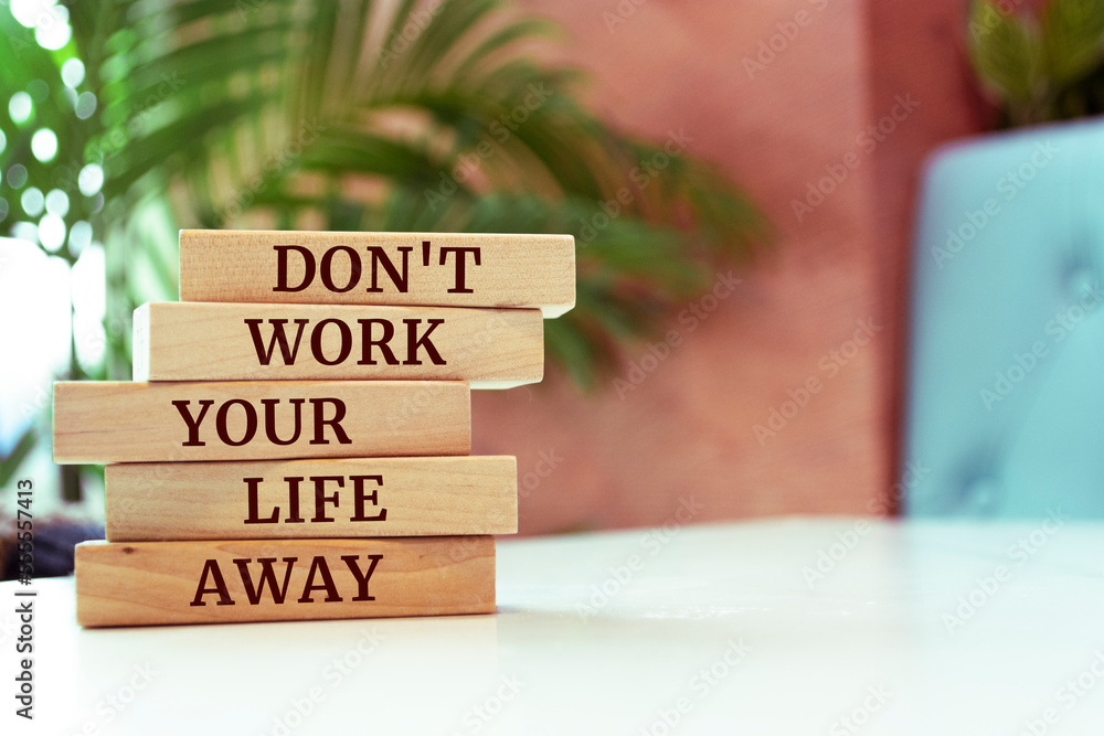 Sticker Wooden blocks with words 'Don't work your life away'.