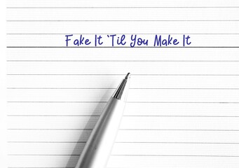 Pen on note book paper planner written Fake It Til You Make It , act the way into new habits until that behavior will become more of a habit and begin to come more easily