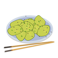 salad with fresh cucumber and black sesame in a round plate with bamboo sticks