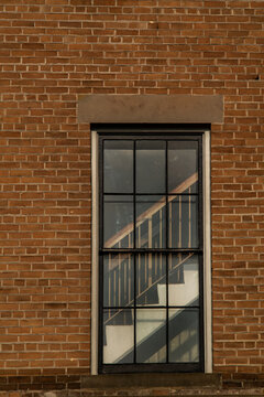 Brick Wall With Stairs Through A Window