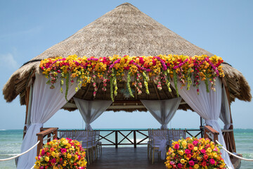 wedding gazebo in Caribbean near the ocean with beautiful flowers