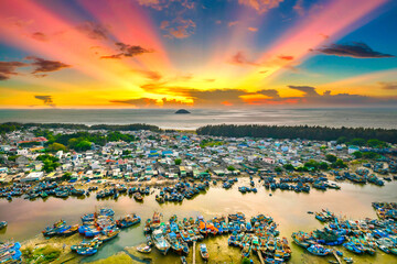 La Gi fishing village, Binh Thuan at dawn with residential area, marina and coastline on the horizon. This place provides seafood for the central market of Vietnam
