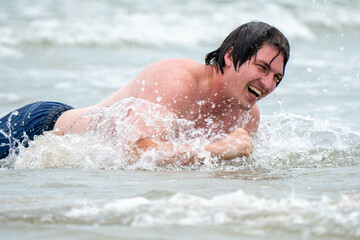 man swimming in water