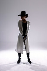 Science fiction bounty hunter backlit and preparing to shoot 9