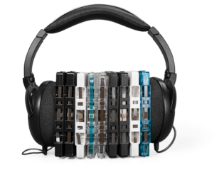 Modern headphones on a stack of CDs disk