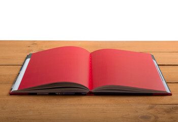 Open old book on wooden desk