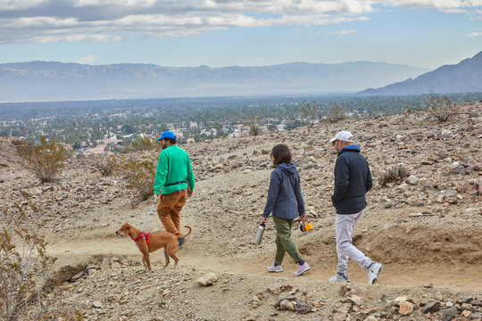 Hiking on path in the mountains near Palm Springs with my husband, dad and dog