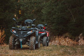 Beautiful nature landscape with ATV awd quadbike motorcycle and cloudscape sky background. Offroad adventure trip. Extreme sports activity. Front view. Concept motocross quadricycle background © Dinno