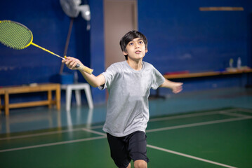 Boys training badminton indoor  activitiy