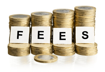 The word FEES on stacks of gold coins money