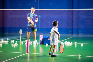 Boys training badminton indoor  activitiy - 555584297
