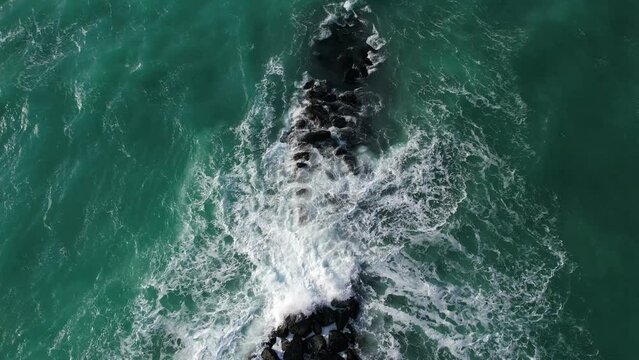 Shooting with a drone on a stone breakwater