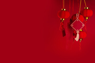 Fototapeta 

 Chinese new year background, with festive Chinese lanterns, paper fans and traditional New Year stripes posters for wishes on bright red background copy space obraz