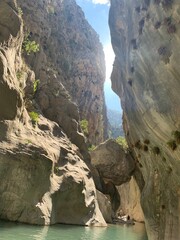 Journey between rocks. Falling stone in a mountain river