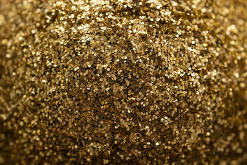 Gold glitter close up. Christmas background, screensaver.