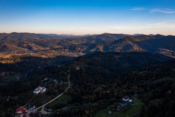 Panorama of a village in the mountains in the shadow of the mountains.