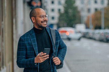 businessman with mobile phone in the street