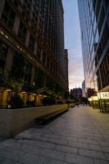 Night street view of Manhattan, roads, and buildings at night. High-quality photo