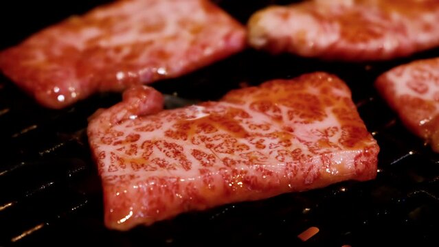 Grilled Wagyu beef sliced Yakiniku in restaurant, Japanese style barbecue.