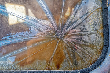 The cracked and damaged rear window of an antique panel truck