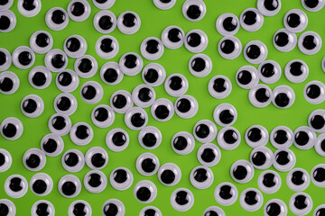 funny  googly eyes isolated on a green background