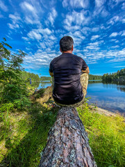person sitting on a rock
