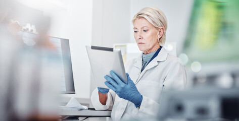 Tablet, thinking and science with a doctor woman at work in a lab for research, innovation or development. Healthcare, medical and idea with a senior female scientist working in a laboratory