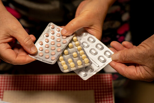 Senior Person Counting Pills, Afraid Of Running Out Of Medicine In Germany Due To Lack Of Supplies