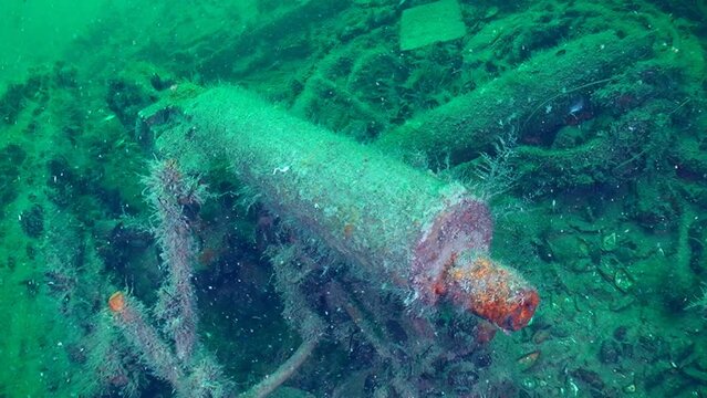 Diving on Snake Island -Machine gun Maxim on the seabed, closeup. Shipwreck of World War 1. Black Sea, Ukraine.