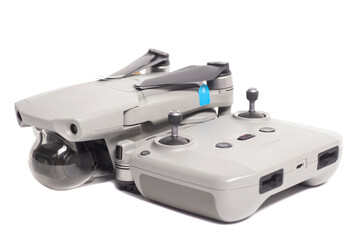 quadcopter drone aerial camera and remote control isolated on white background