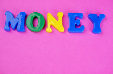 'MONEY' Word spelled out in colorful alphabet. Business and financial concept.