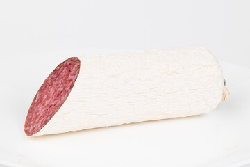 Salami sausage on a white background, close-up.