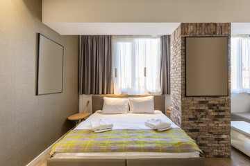 Interior of a hotel bedroom with master bed