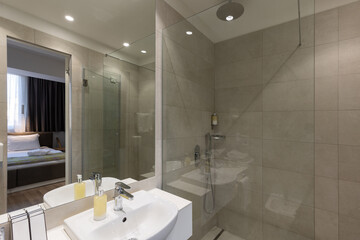 Bathroom interior with glass shower cabin