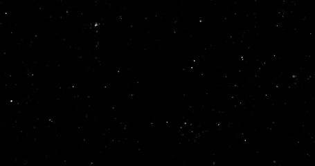 Random flashing and glittering white lights on black background	