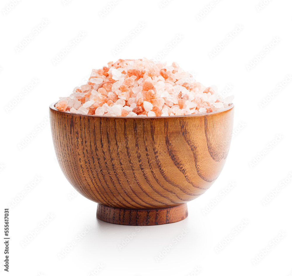 Wall mural pink himalayan salt in bowl isolated on white background.