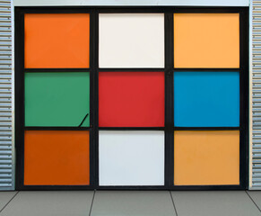 metal door formed by squares of many colors. The door inspires joy and happiness