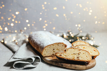 Christmas stollen on a gray background with highlights.